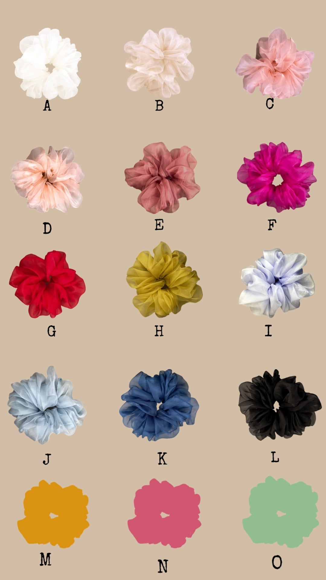 A collection of 15 scrunchies, crafted with silk organza, is arranged in three columns, each featuring a unique color. Labels A to O accompany the scrunchies. The colors range from white and pink to dark blue and black, all displayed on a beige background—perfectly complementing a Noémiah Arlette Top.