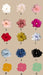 A collection of 15 scrunchies, crafted with silk organza, is arranged in three columns, each featuring a unique color. Labels A to O accompany the scrunchies. The colors range from white and pink to dark blue and black, all displayed on a beige background—perfectly complementing a Noémiah Arlette Top.