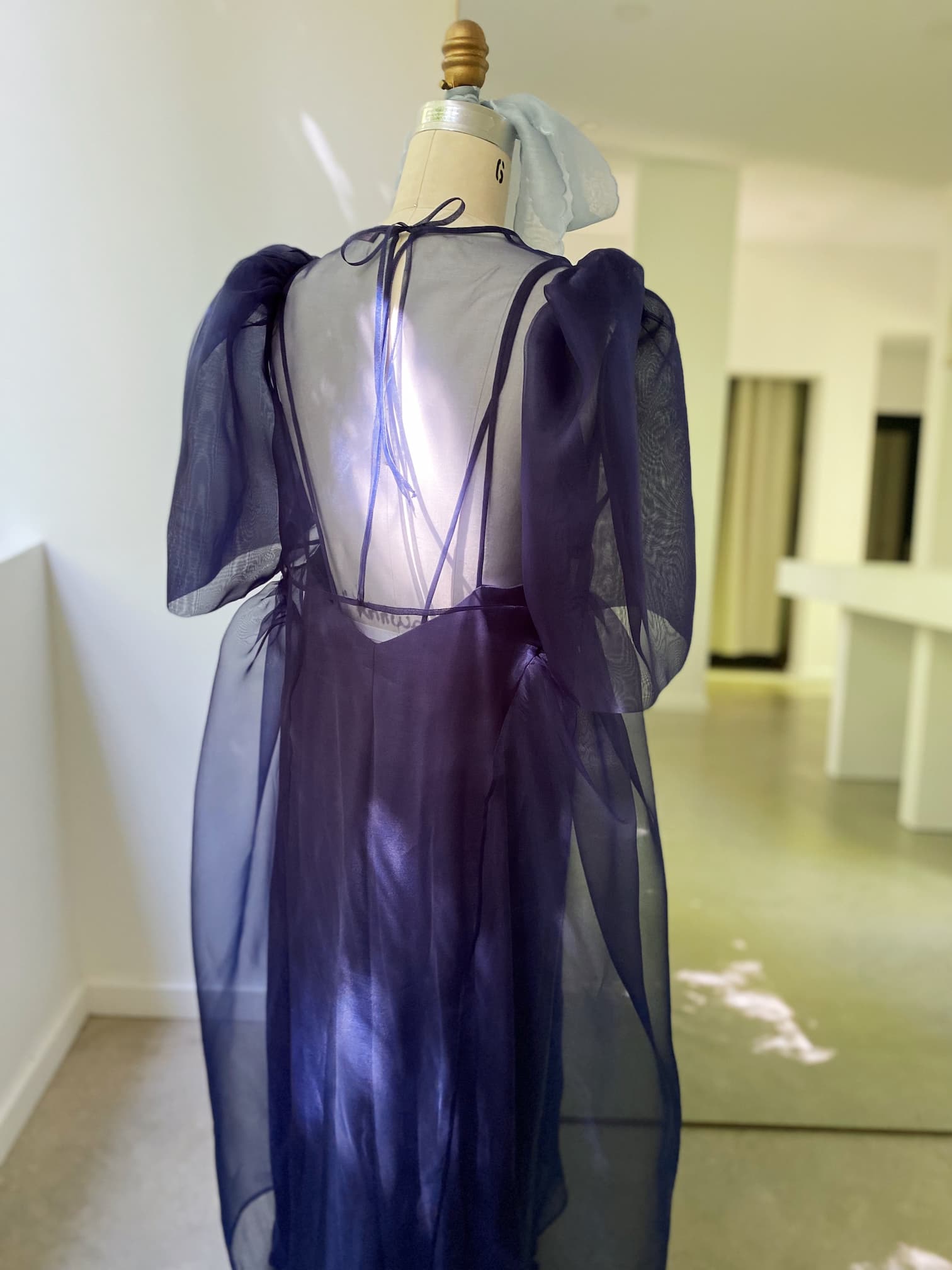 sheer organza dress S Black Cape Overlay Gown The interplay of transparency and layering brings depth UO Sheer Organza Midi Dress
