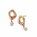 The Scarlett Earrings by Noémiah feature gold hoops with organic shapes and natural white freshwater pearls, offering a unique touch with their irregular loop designs.