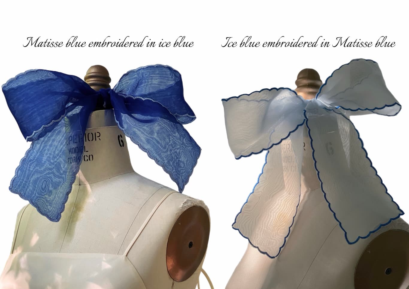 Two Noémiah Silk Ribbon bows, one deep blue with light blue edging and the other light blue with deep blue edging, are displayed on dress forms. Text labels highlight their veil-like effect and unique color combinations.