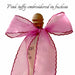 A sheer Silk Ribbon — Classic by Noémiah with scalloped fuchsia edges is tied in a large bow around a bottle’s neck. Above, cursive text reads: Pink taffy embroidered in fuchsia.