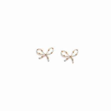 A pair of Sol Earrings, delicately crafted from 14K solid gold and adorned with small freshwater pearls, elegantly placed on a plain white background. Part of the Noémiah collection, these earrings exude timeless sophistication.